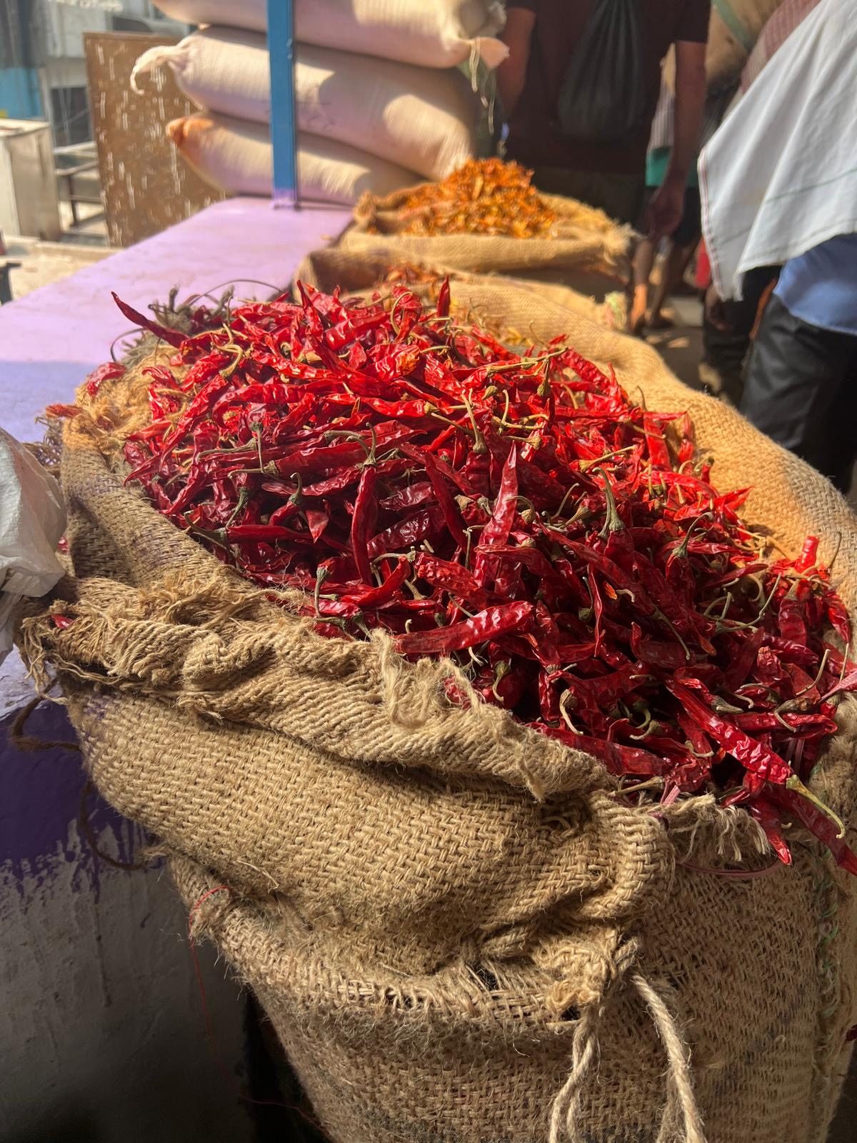 Chillies drying at market