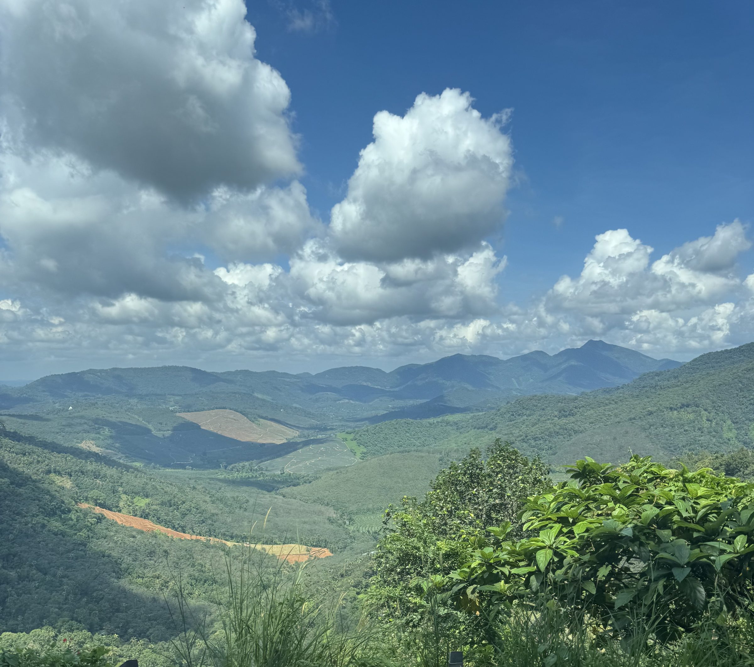 Green hills under a wide sky