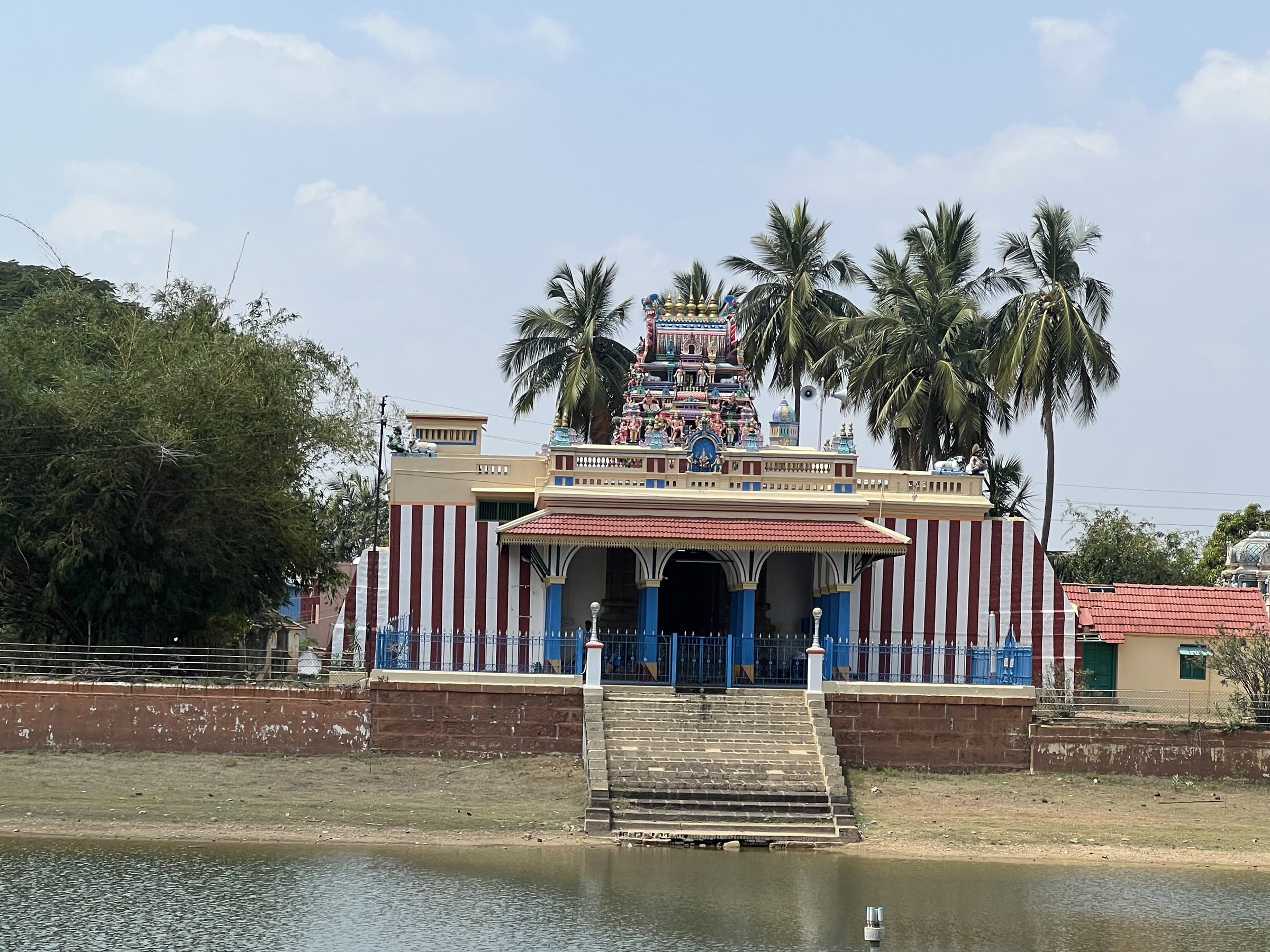Small painted temple by water