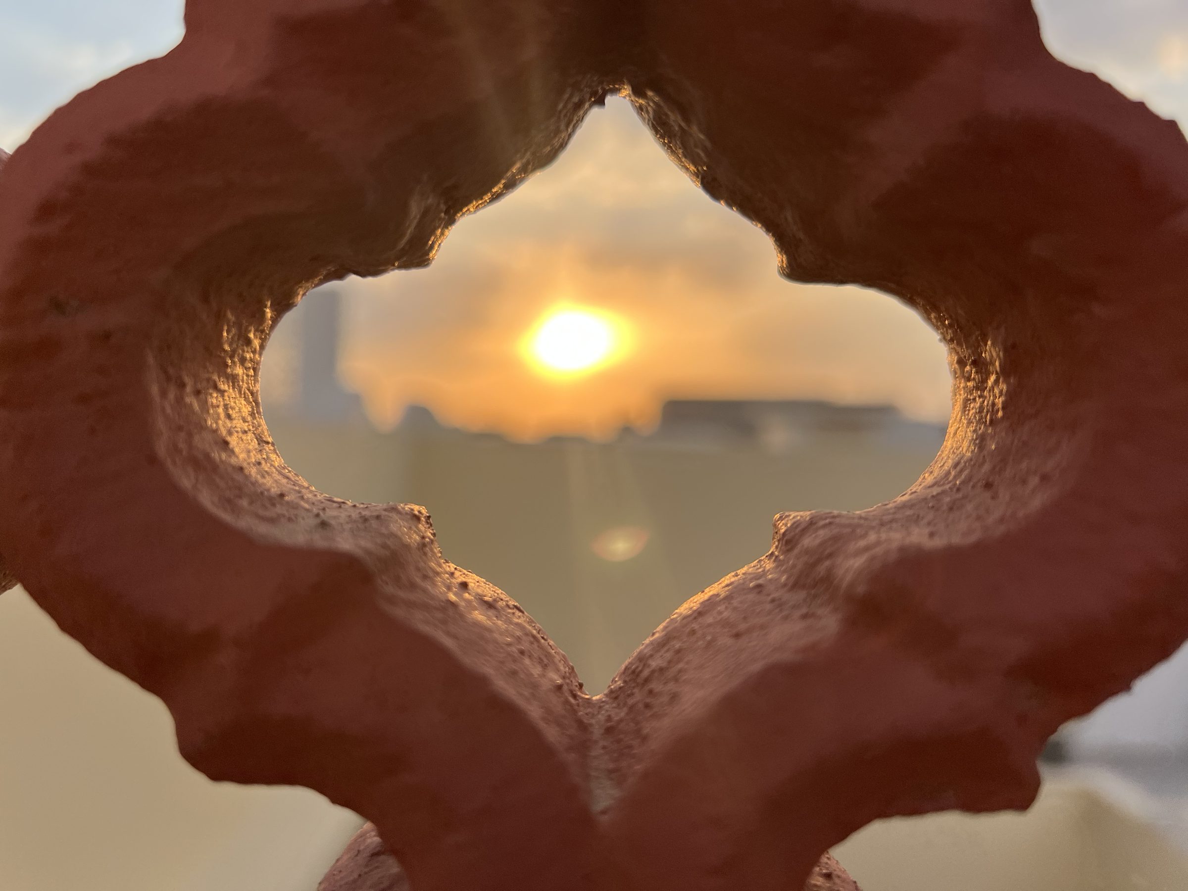 Sun through a decorative arch