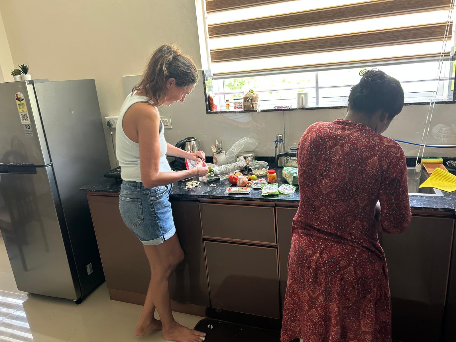 Lottie and Jesna cooking together in the kitchen